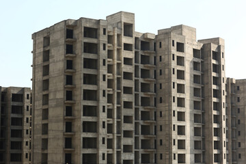 Fototapeta premium Unfinished Concrete Apartment Buildings Under Construction