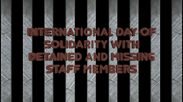 International day of solidarity with detained and missing staff members animation on metallic background
