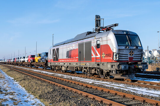 Cuxhaven, Germany - February 18, 2026: car-carrying freight train with mkb G&uuml;terverkehr Siemens Vectron Dual Mode locomotive
