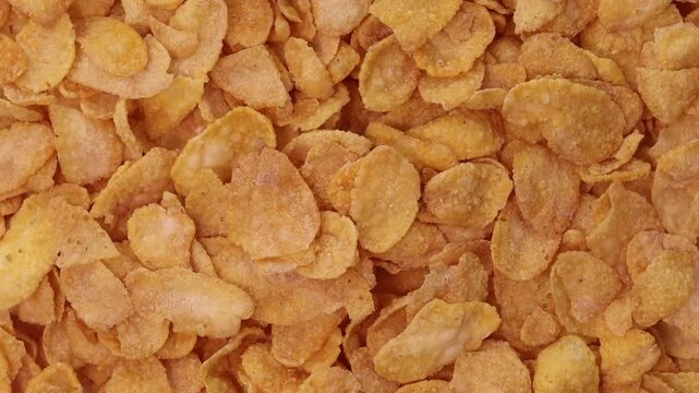 orange cornflakes rotating closeup full frame texture background