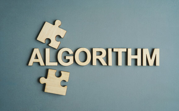 Algorithm Word Text with Wooden Jigsaw Puzzle Pieces on Gray Background for Problem Solving Concept
