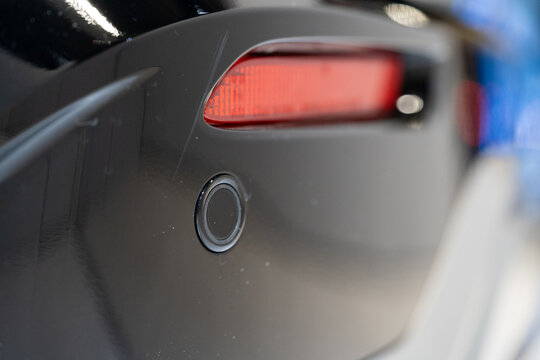 Close up of car rear parking sensor on bumper