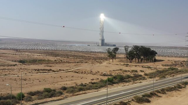 Aerial view of Ashalim solar power station tower and heliostats in the Negev desert wilderness Israel