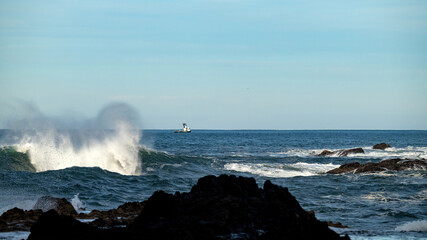 Ship in the Pacific Ocean and giant wave © knowlesgallery