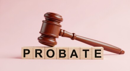 A wooden gavel resting beside a block spelling out probate on a light background