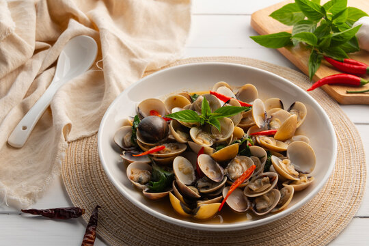 Stir Fried Clams with Sweet Basil in a plate.Thai food.(Puff meretrix or Meretrix casta)