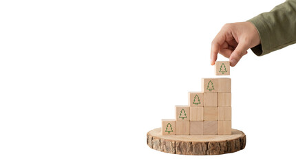 A person's hand placing a wooden block on a stack of blocks