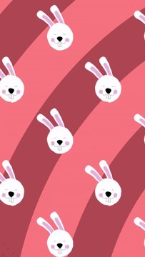 Vertical video: Playback starting, rabbit heads sliding down over pink diagonals, forming loop