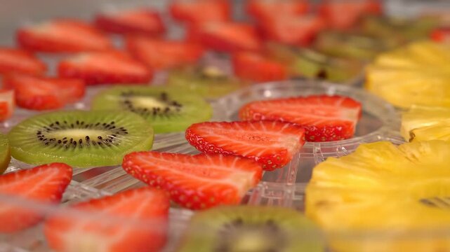 Close up of strawberry, kiwi, pineapple slices for healthy snack. Fruits snack.