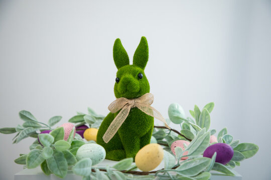 green Easter bunny against a white wall
