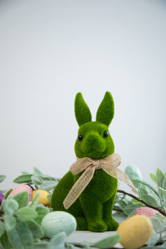 green Easter bunny against a white wall
