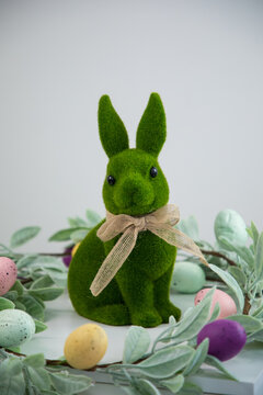 green Easter bunny against a white wall
