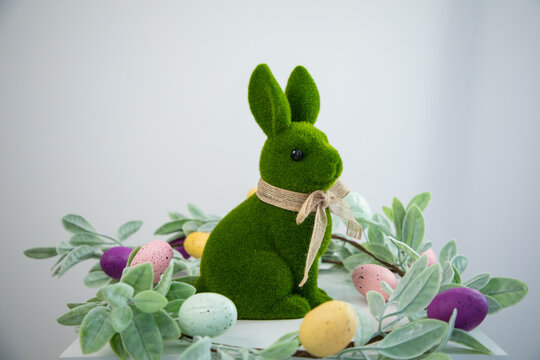 green Easter bunny against a white wall
