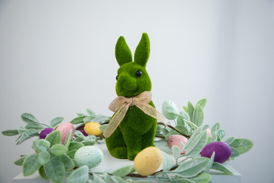 green Easter bunny against a white wall
