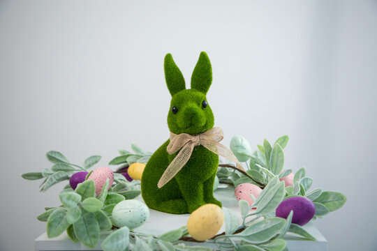 green Easter bunny against a white wall
