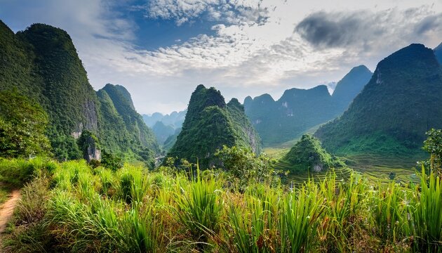 towering karst formations at the ha giang loop vietnam lush valleys