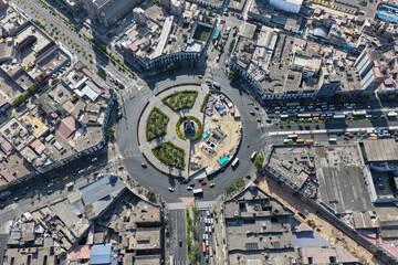 Aerial view of a plaza with multiple street intersections in a city