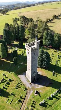 Epic Cinematic Drone Flight Above Macdonald Memorial Tower and Dingwall Town in the Scottish Highlands, Scotland &ndash; Historic Stone Landmark Rising Over Scenic Highland Landscape
