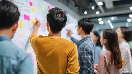 Obraz premium Dynamic Team Collaboration With Colorful Sticky Notes and Engaged Participants