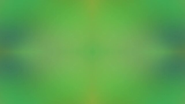 A blurred green abstract background with motion effect, creating a dynamic and artistic visual