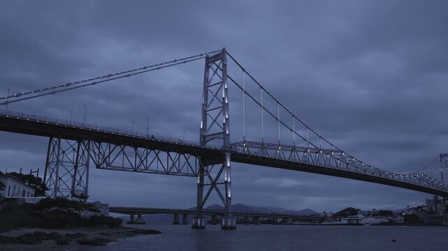 Florianopolis, night view of the Herc&iacute;lio Luz suspension bridge with the Santana fort in the left side. panoramic