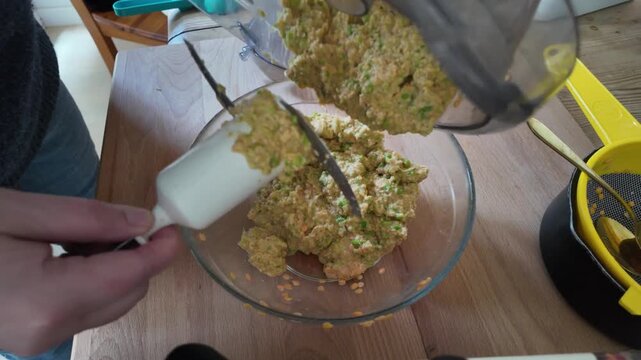making red lentil patties with green peas in a food processor