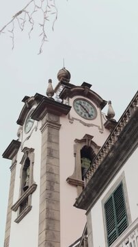 Traditional Portuguese baroque church architecture with clock tower, Madeira island