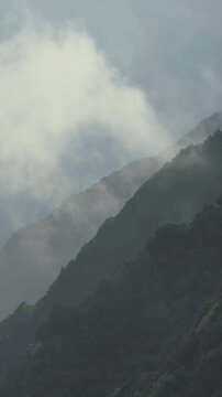 Foggy tropical landscape over the Atlantic Ocean coastline, Madeira, Portugal