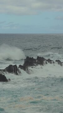 Atlantic Ocean surf hitting rocky coastline, Apple Log 2, Vertical