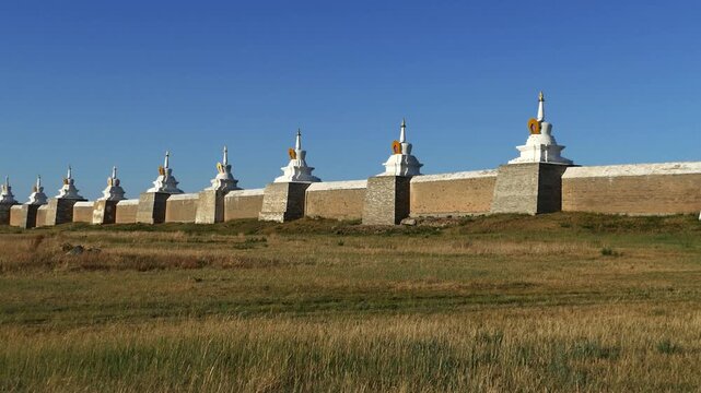 The walls and gates of the ancient Mongolian monastery. Stupas are sacred Buddhist structures, masonry. Monastery  Erdene Zuu,  Kharkhorin, Mongolia. Sunny summer day.