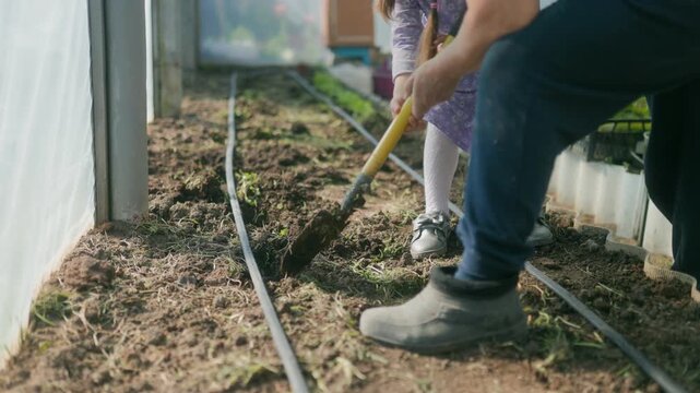Planting in the Greenhouse Grandmother and Granddaughter Bond