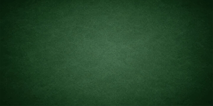 Empty vintage green chalkboard background with a grunge texture and old paper material pattern for a blank wallpaper surface backdrop