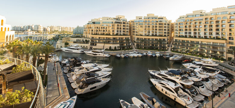 Luxury yachts docked at Portomaso Marina in beautiful St. Julians, Malta