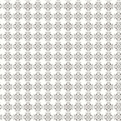 Obraz premium Seamless pattern of black floral designs on white background