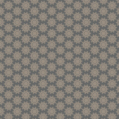 Seamless pattern of beige floral ornaments on grey background