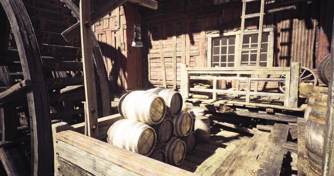 Warm sunlight filters through a rustic wooden structure, illuminating stacked barrels near a wooden platform. The scene captures the charm of a historic mill filled with character.