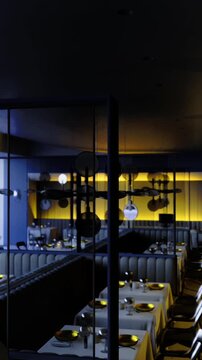 This dining area features sleek furniture and ambient lighting, creating a sophisticated atmosphere. Large windows provide a stunning view of the Martian landscape, enhancing the overall experience.