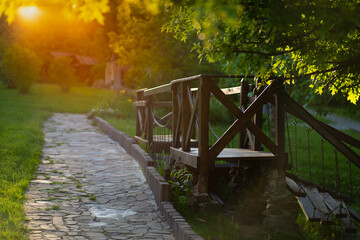 Obraz premium Dreamy Soft Focus Garden Path at Sunset. Golden Hour Nature Background