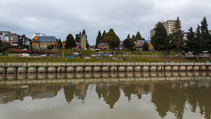 reflection of  San Carlos de Bariloche, Civic Center, Patagonia Argentina glacial lake Nahuel Huapi