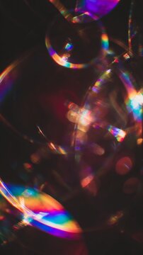 Light leaks Lens flare holographic effect vertical background. Texture of retro film overly, image with scratch, dust and lights