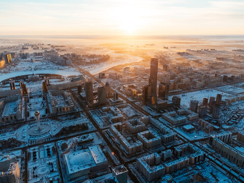 Aerial drone view Nur-Sultan, Kazakhstan Qazaqstan city center with skyscrapers and Baiterek Tower.