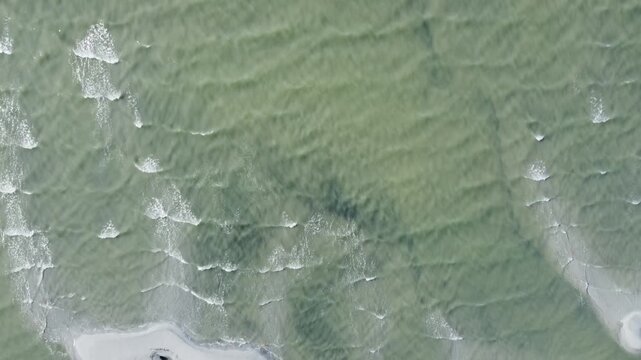 Waves on Great Salt Lake shore above