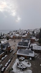snow in Bariloche's main square, with Alpine-inspired architecture and the cathedral tower in the background. San Carlos de Bariloche, Patagonia, Argentina. Andes Mountains