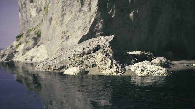 Jagged rock formation beside dark water, sunlit strata reveal layered geology, sharp shadows accentuate steep relief, mirror surface doubles monolithic shapes,
