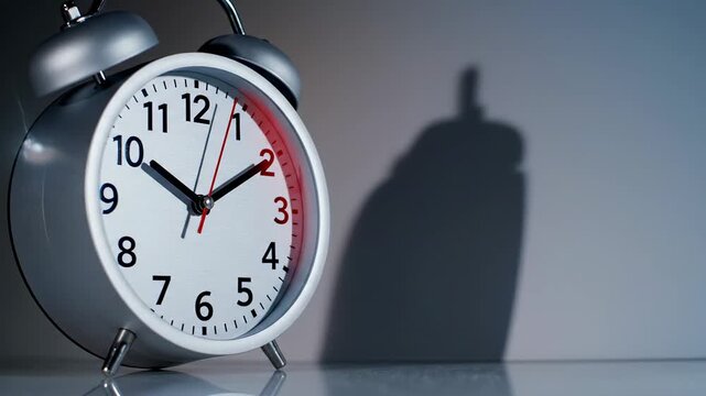 Time Pressure Concept with a minimalist desk clock placed against a neutral gradient backdrop, bold shadow cast behind the clock emphasizing tension, crisp numerals and precise markers sharply