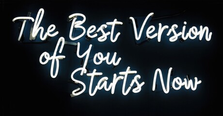 Obraz premium Bright neon sign displays motivational phrase. White cursive lettering contrasts dark background. Positive message, inspiring growth.