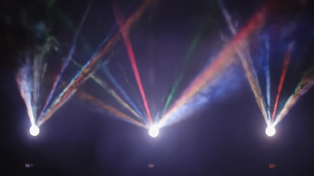Dynamic shot of colorful stage lights projecting vibrant beams in smoke