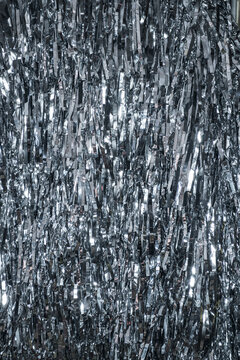 Silver tinsel with glitter and bokeh effect background