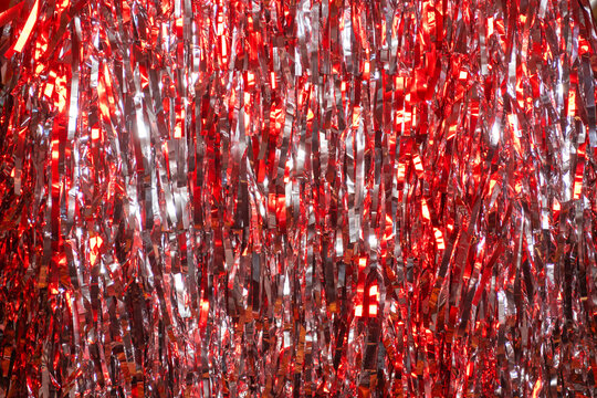 Red and silver glitter tinsel abstract texture bokeh