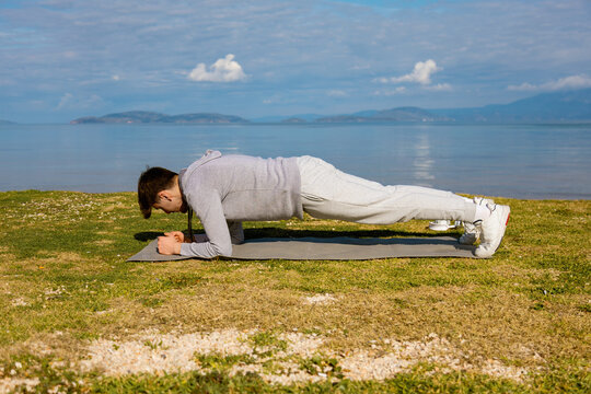 Young man exercising outdoors on a bright sunny day